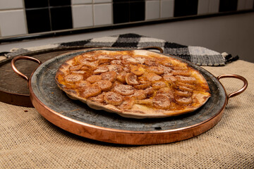 Sweet Brazilian pizza with banana, cinnamon and sugar
