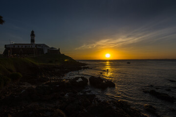Fototapeta na wymiar Beautiful sunset seen at Barra Lighthouse (Farol da Barra) - Salvador, Bahia, Brazil