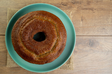 banana cake in green plate on wooden table