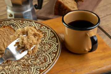 a few slices of banana cake with a cup of coffee