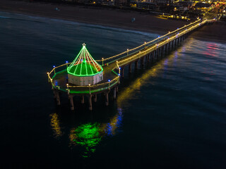 Manhattan Beach Pier with Christmas lights in California. Aerial View from end of Pier at an angle.