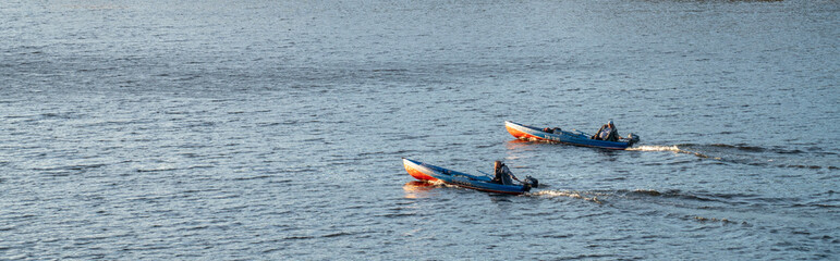 two boats floating on the river