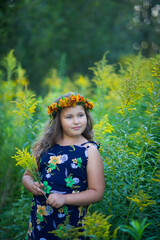 girl in a wreath of dandelions