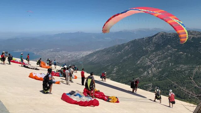 Paragliding in Turkey. Preparing for a parachute jump. Paragliding launch site. Turkey, Oludeniz, Mount Babadag, August 8, 2021