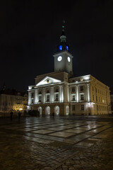 Fototapeta na wymiar The Town Hall in Kalisz, Poland at night