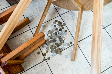 Tables overturned and coins strewn .