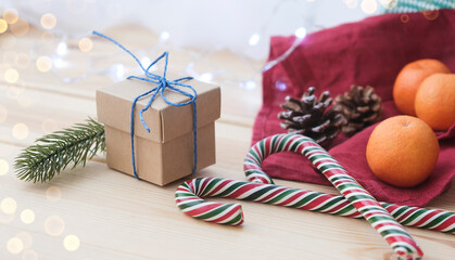 Fototapeta na wymiar Small handmade gift box over shiny ornaments