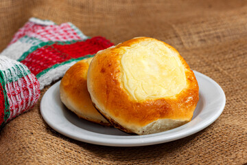 two buns with cottage cheese in a white plate