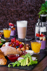Breakfast or brunch set for two person on rustic wooden table