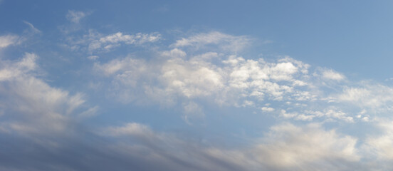 Dark blue majestic sky with big light clouds.	
