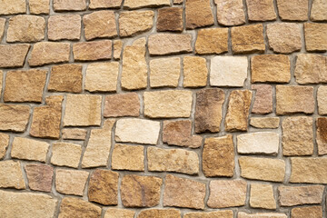 Antique Stone wall of mosaic exterior cover on building, material Seamless textured wall background from Natural stone rock