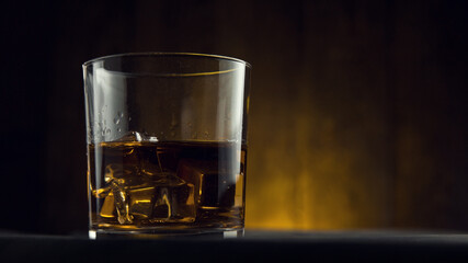 a glass of wiskey on the rocks