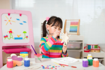 young girl makingcraft for homeschooling