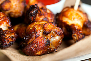 baked chicken wings together with ketchup