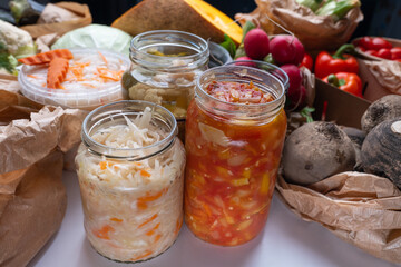 Homemade fermented in glass jars, pickled food healthy vegetables, fruit harvest. Winter fermented and canning superfood concept. Probiotics, enzymes, nutritiion veggy preservation. Selective focus