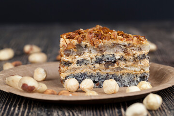 sweet cake with buttercream and sponge cake and lots of poppy seeds and nuts