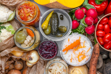 Homemade fermented in glass jars, pickled food healthy vegetables, fruit harvest. Winter fermented and canning superfood concept. Probiotics, enzymes, nutritiion veggy preservation. Selective focus