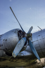 Propeller and engine of an old airplane IL-14. Abandoned plane exterior.