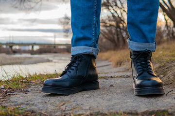 men's feet in winter leather boots