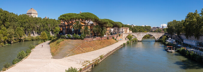 Rome - The panorama of Isola Tiberiana - Tiberian Island with the Ponte Cestio bridge.