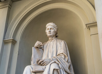 The statue of Italian and Florentine architect Arnolfo di Cambio, located in a niche in front of the  right side of Florence Cathedral, Florence city center, Tuscany region, Italy