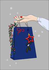 Kobieca ręka trzymająca torebkę podarunkową. Dziewczyna oferująca prezent. Bożonarodzeniowa ilustracja z pakunkiem prezentowym, bombką, wstążką i innymi świątecznymi dekoracjami. Wektorowa ilustracja.