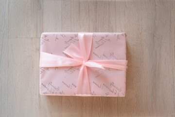 pink gift box on wooden background