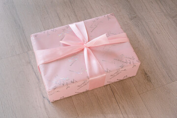 pink gift box on wooden background
