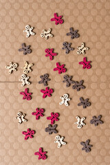 wooden gingerbread figures on fancy paper