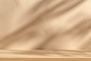 Wooden table mockup on beige stucco background with branch shadows on the wall. Mock up for...