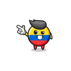 colombia flag mascot pointing top left