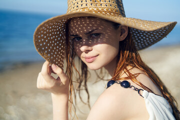 pretty woman with hat on island beach ocean summer fun