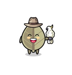 dried leaf zookeeper mascot with a parrot