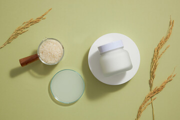 wheat and rice extract in petri dish light green background with cosmetic jar for product advertising , traditional food content , top view