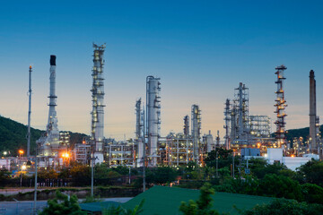 Obraz na płótnie Canvas oil refinery plant in a petrochemical estate at blue dusk