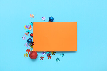 Blank card, Christmas decorations and confetti on color background