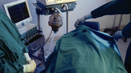 Dead patient surgeon doctor covering face on bed finished operate, Medical surgical doctor team...