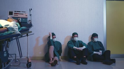 Tired doctor, Group of surgery doctors sadness fatigue after surgery, emotional sitting stress of...