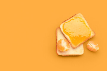 Tasty toast with tangerine jam on orange background