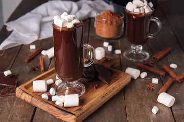  Glass cups of tasty hot chocolate with marshmallows on wooden background © Pixel-Shot