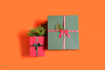 Beautiful Christmas gift boxes on orange background