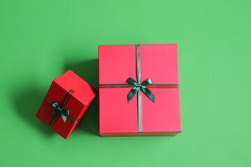 Beautiful Christmas gift boxes on green background