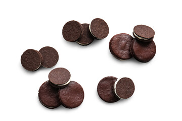 Tasty chocolate cookies with cream on white background