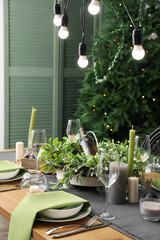 Dining table with beautiful setting for Christmas celebration indoors