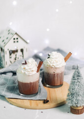 Still life. Celebration atmosphere. Beverages. Coffee with cream. Christmas. Light background.