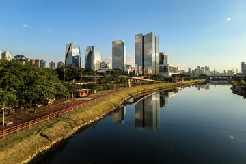 Fototapeta na wymiar Modern office buildings and Pinheiros River in Sao Paulo city, Brazil.