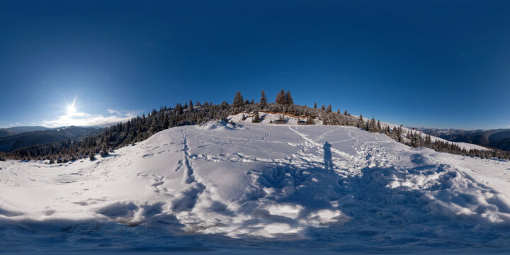 Panorama of the snowy hills in Paltinis