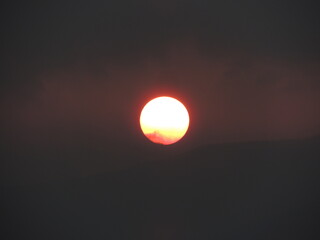 The red sun in the western sky