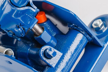 close-up view on hydraulic valve and piston of floor car jack