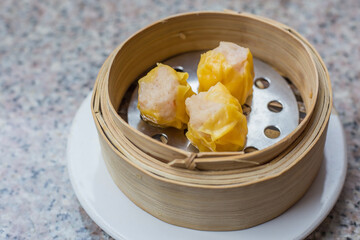Delicious dim sum or dumpling is a snack from China and Hong Kong. Shumai or Kanom Jeeb or Steamed Pork and Shrimp Dumplings Shumai is a chinese cuisine dish with minced pork meat, shrimps.